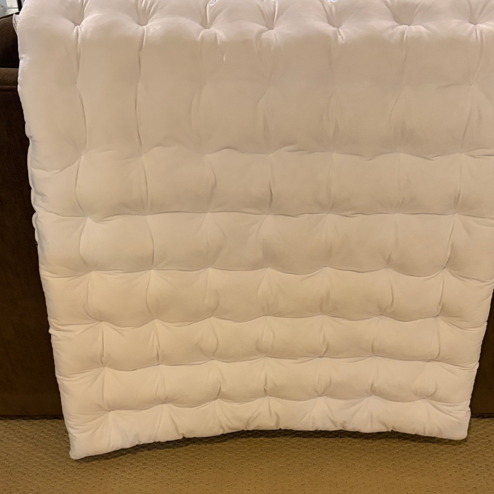 White Quilted padded Dormify headboard for twin bed.